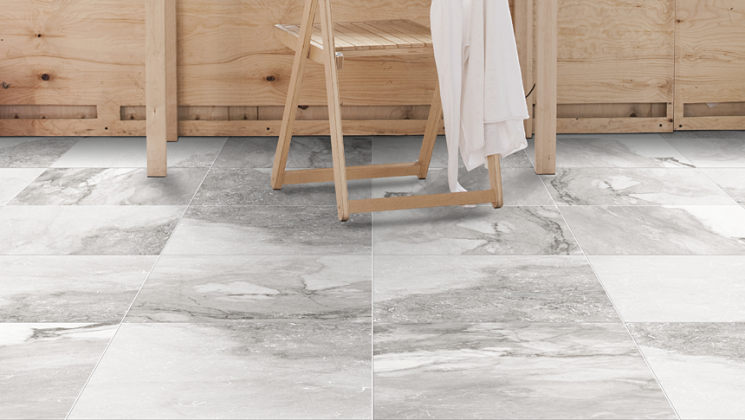 12" by 24" grey porcelain tile flooring near wooden table